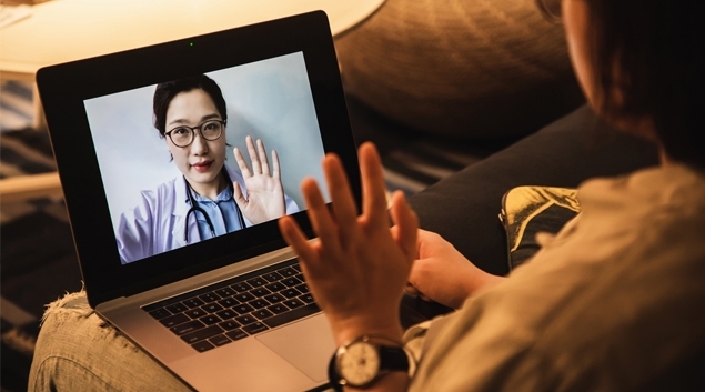 Patient talking to doctor on tablet