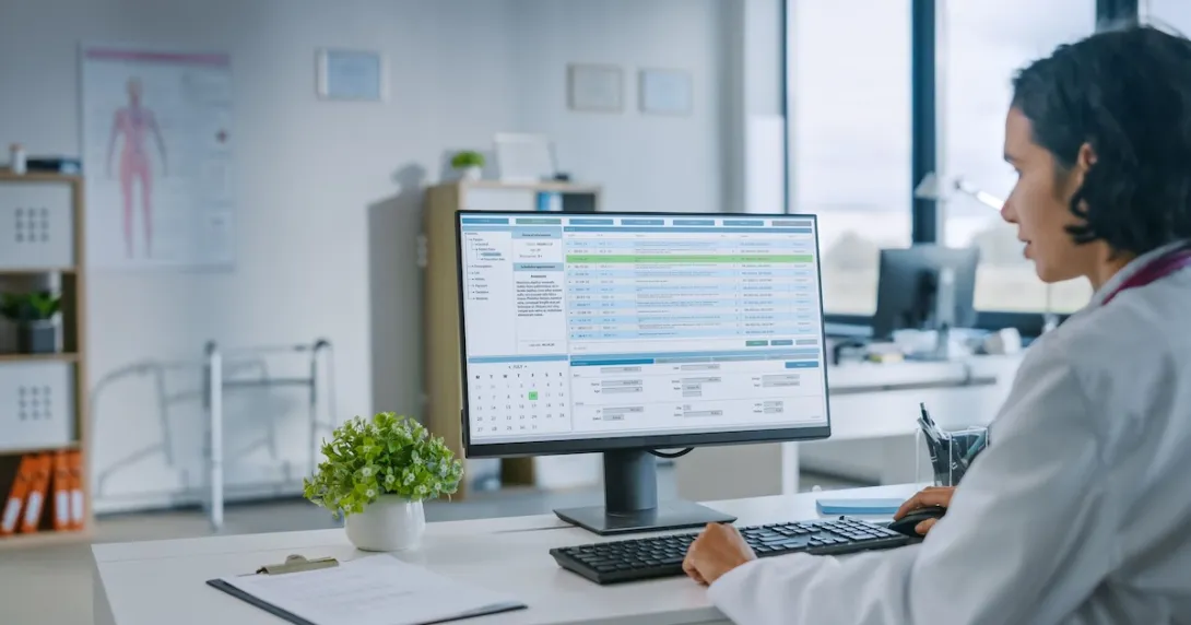 A doctor reviewing a patient's chart A doctor reviewing a patient's chart
